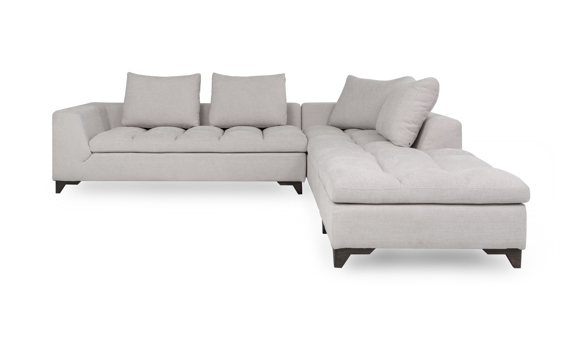 Modular Con Puff Vitaro frente Vista frontal del Modular con Puff Vitaro Plus Plumas de Aristas. Un diseño moderno con un tapizado suave y elegante, un asiento acolchado y patas discretas en madera color Ceniza.